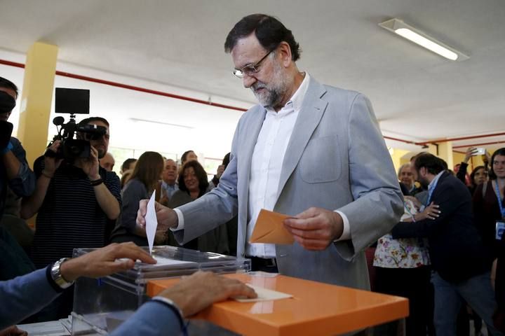 Spain's Prime Minister Rajoy votes at a polling station during regional and municipal elections in Madrid