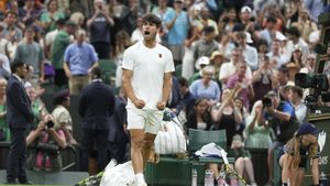 Spains Carlos Alcaraz celebrates after beating Russias Andrey Rublev during a fourth round mens singles match at the Wimbledon Tennis Championships in London, Sunday, July 6, 2025. (AP Photo/Alastair Grant)