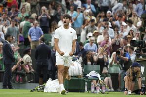 Spains Carlos Alcaraz celebrates after beating Russias Andrey Rublev during a fourth round mens singles match at the Wimbledon Tennis Championships in London, Sunday, July 6, 2025. (AP Photo/Alastair Grant)