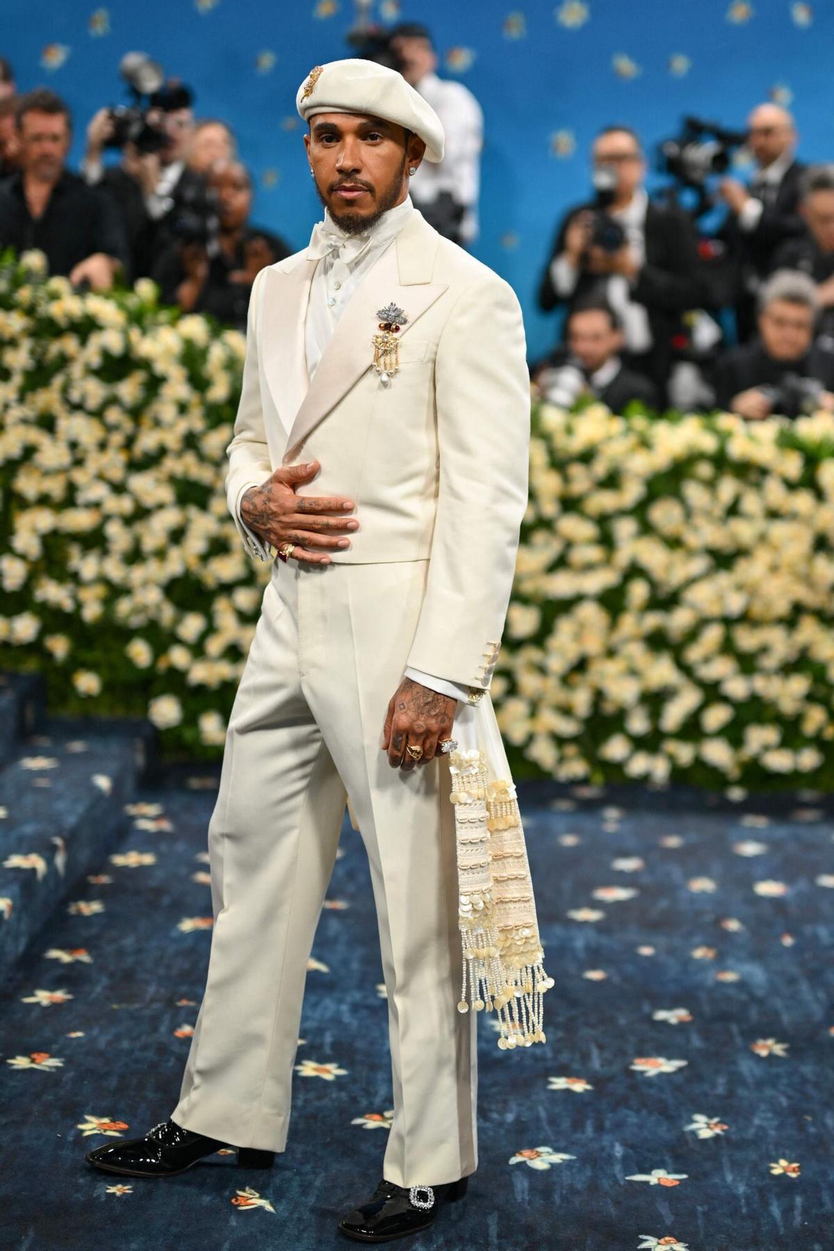 British race car driver Lewis Hamilton arrives for the 2025 Met Gala at the Metropolitan Museum of Art on May 5, 2025, in New York. The Gala raises money for the Metropolitan Museum of Art's Costume Institute. The 2025 Met Gala is themed "Tailored for You," aligning with the Costume Institute’s exhibition, "Superfine: Tailoring Black Style," set to open to the public on May 10. (Photo by Angela WEISS / AFP)