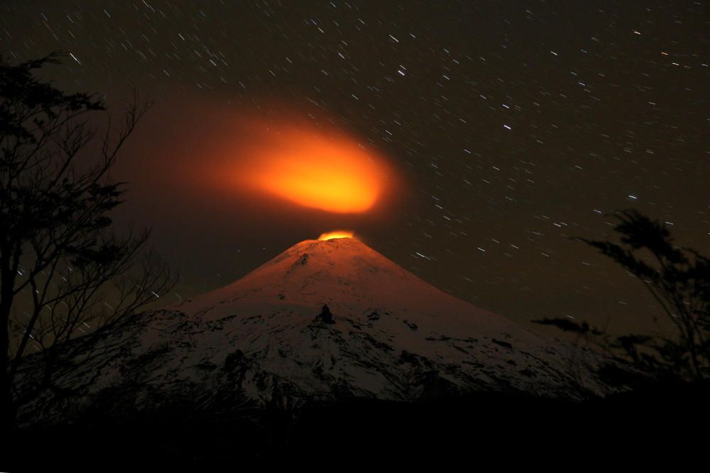 Villarrica Volcano is seen at night from ...