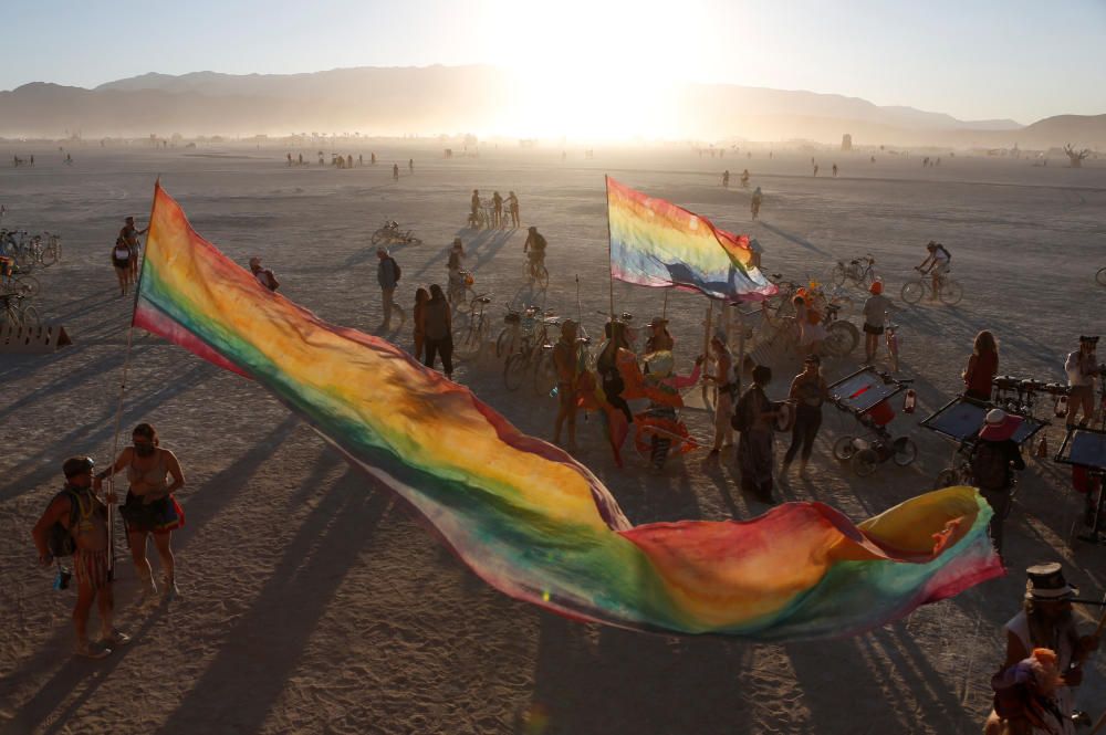 The sun sets on the playa as approximately ...