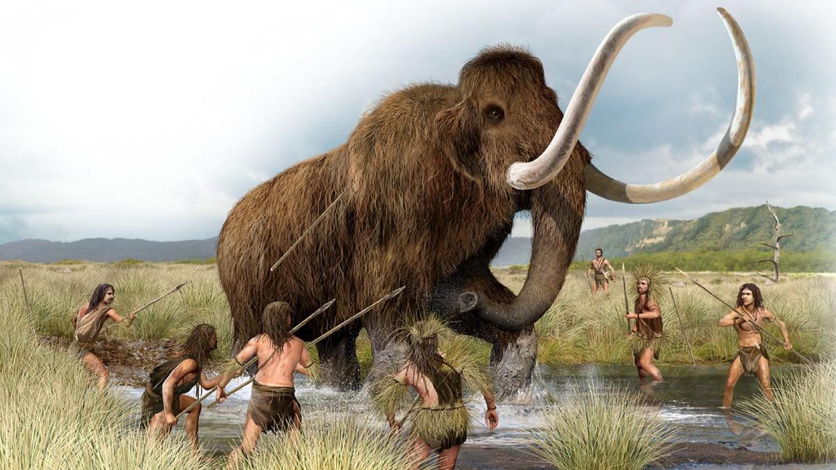 Hombres prehistóricos dando caza a una mamut, en una recreación artística