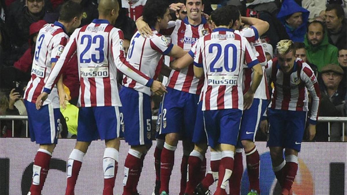 Los jugadores del Atlético celebrando el gol de Torres