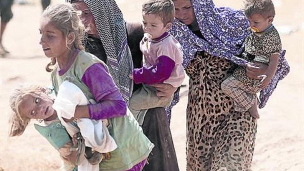 Mujeres y niños yazidís desplazados de Sinjar, en agosto.