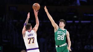 LOS ANGELES, CALIFORNIA - FEBRUARY 22: Hugo Gonzalez #28 of the Boston Celtics plays defense on Luka Doncic #77 of the Los Angeles Lakers during the first half of their game at Crypto.com Arena on February 22, 2026 in Los Angeles, California. NOTE TO USER: User expressly acknowledges and agrees that, by downloading and or using this photograph, User is consenting to the terms and conditions of the Getty Images License Agreement. Luiza Moraes/Getty Images/AFP (Photo by Luiza Moraes / GETTY IMAGES NORTH AMERICA / Getty Images via AFP). NOTE TO USER: User expressly acknowledges and agrees that, by downloading and or using this photograph, User is consenting to the terms and conditions of the Getty Images License Agreement