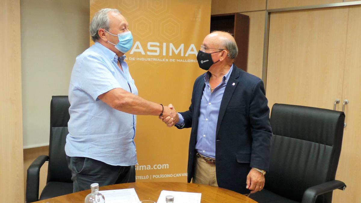 Firma del convenio entre ASIMA y TRUEWORLD Organization.