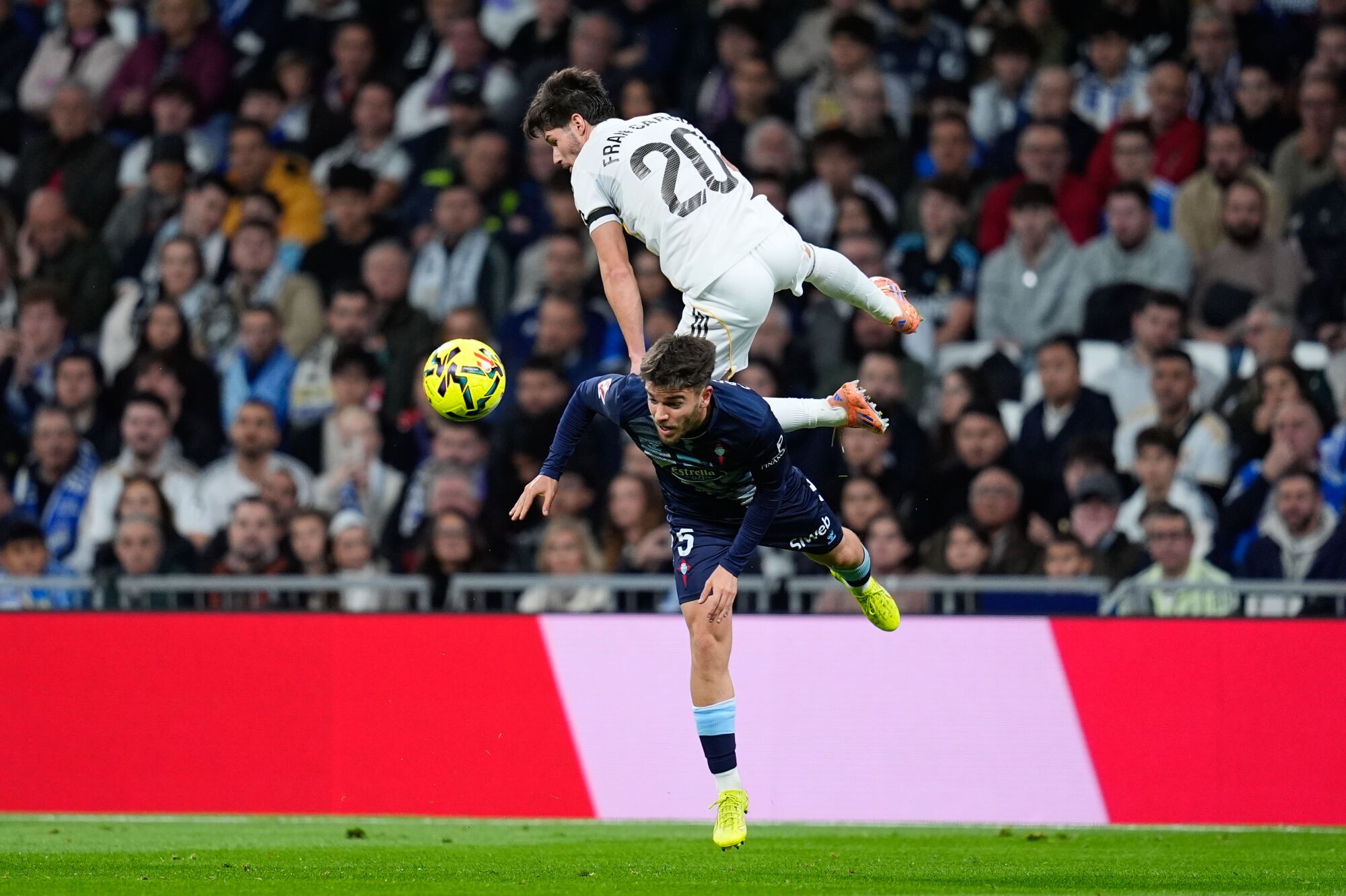 Fran Garcia of Real Madrid CF and Sergio Carreira of RC Celta de Vigo compete for the ball during the Spanish League, LaLiga EA Sports, football match played between Real Madrid and RC Celta de Vigo at Bernabeu stadium on December 07, 2025, in Madrid, Spain. AFP7 07/12/2025 ONLY FOR USE IN SPAIN. Dennis Agyeman / AFP7 / Europa Press;2025;SOCCER;SPORT;ZSOCCER;ZSPORT;Real Madrid v RC Celta de Vigo - LaLiga EA Sports;