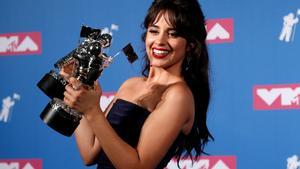 2018 MTV Video Music Awards - Photo Room - Radio City Music Hall, New York, U.S., August 20, 2018. - Camila Cabello poses backstage with her awards for Artist of the Year and Video of the Year for Havana. REUTERS/Carlo Allegri      TPX IMAGES OF THE DAY