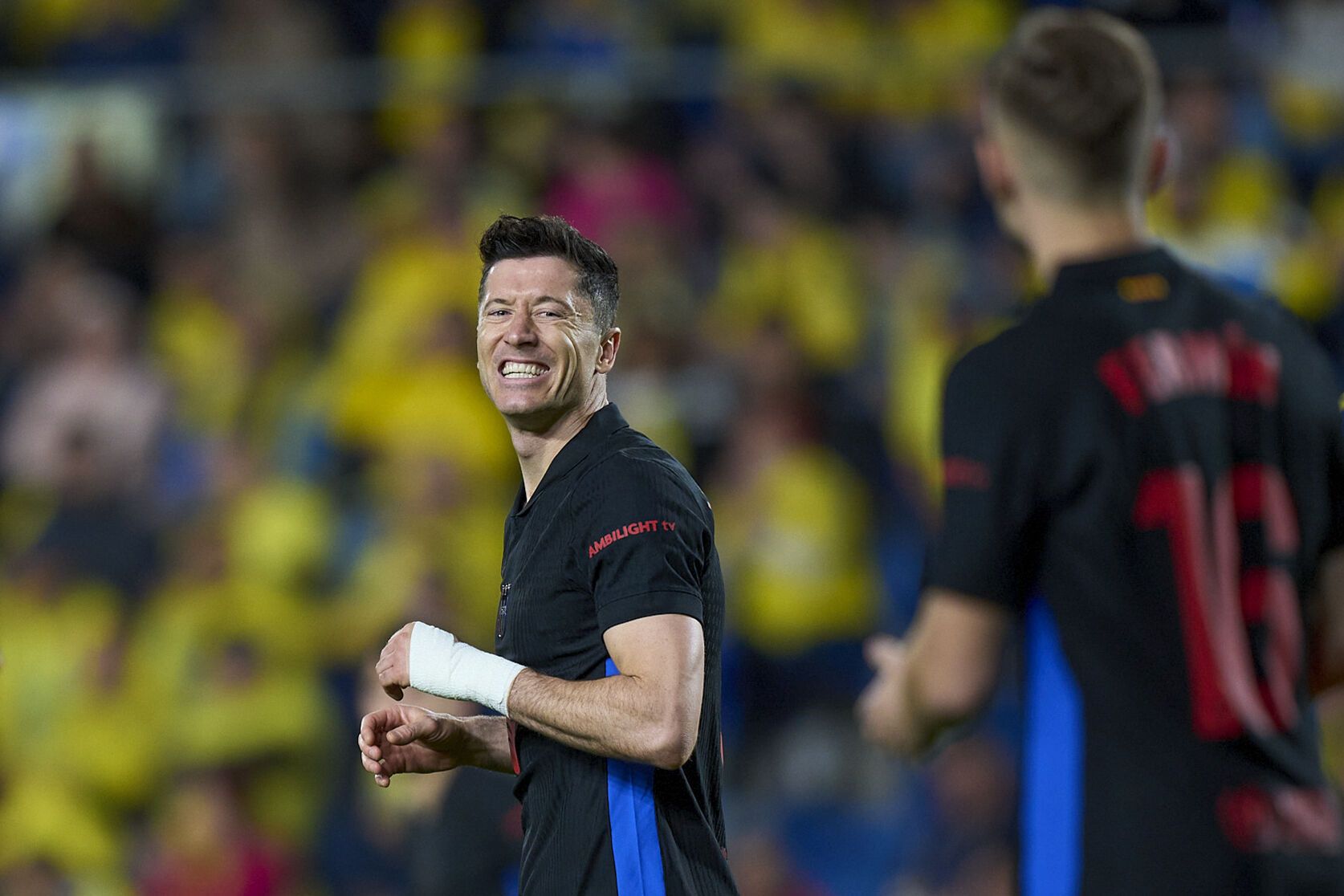 Barcelona's Robert Lewandowski smiles during the Spanish La Liga soccer match between Las Palmas and Barcelona at the Gran Canaria stadium in Las Palmas, Spain's Canary Islands, Saturday, Feb. 22, 2024. (AP Photo/Gabriel Jimenez)