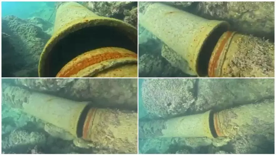 Un submarinista enseña la rotura en el aliviadero del Cabo de la Huerta de Alicante