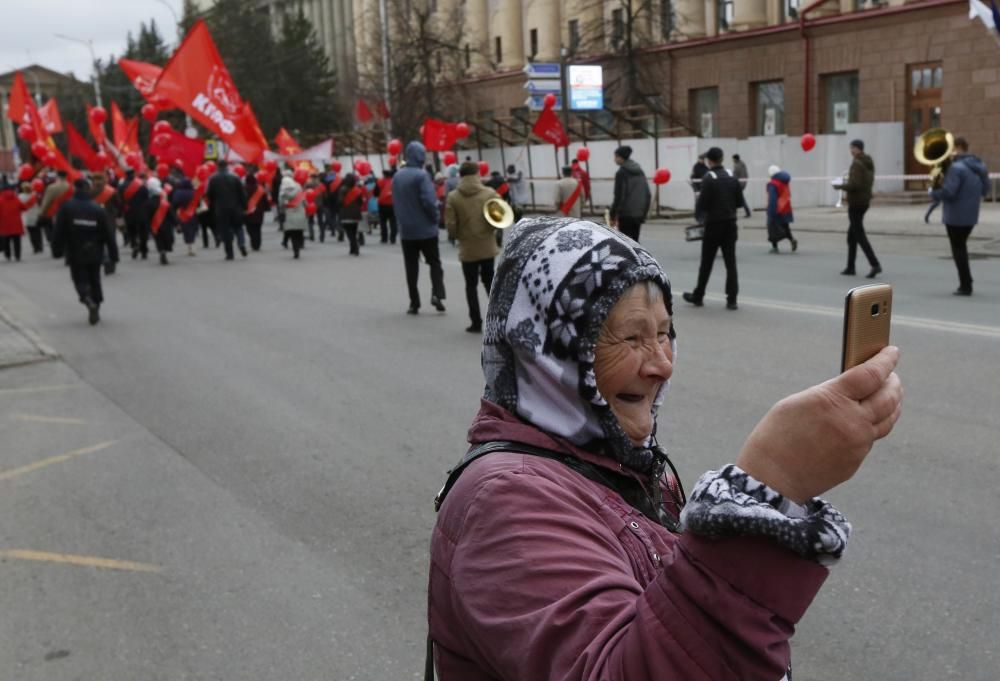 Woman takes selfie during May Day rally held by ...