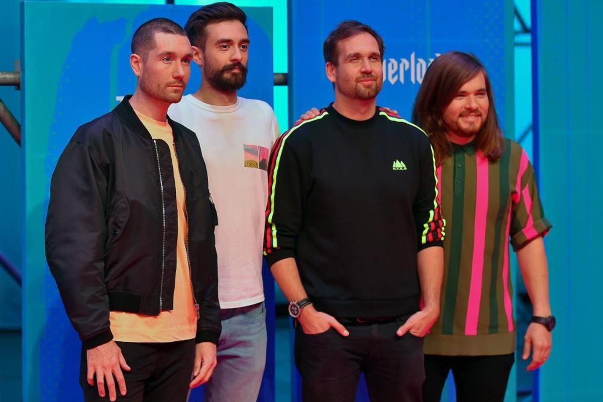 British band Bastille pose on the red carpet ahead of the MTV Europe Music Awards at the Bizkaia Arena in the northern Spanish city of Bilbao on November 4, 2018. (Photo by ANDER GILLENEA / AFP)