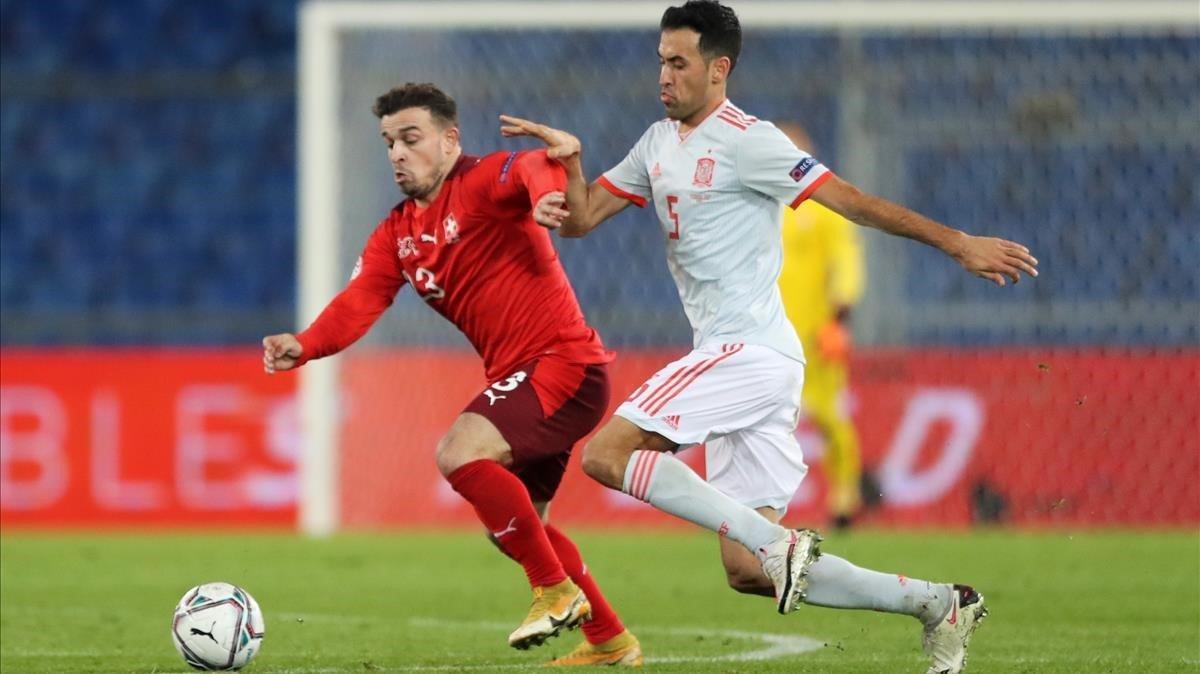 Xherdan Shaqiri in action with Spain s Sergio Busquets