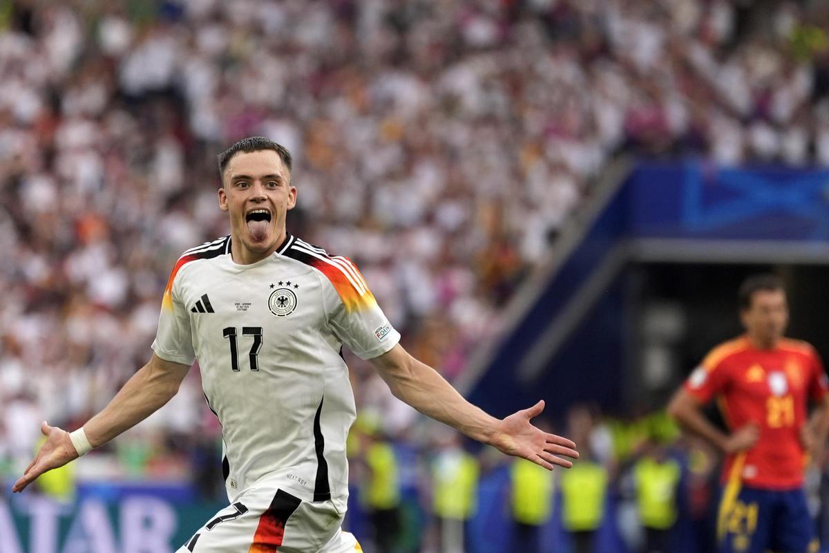 The German Florian Wirtz celebrates after scoring his team's first goal during a quarterfinal match between Germany and Spain in the 2024 Eurocup.