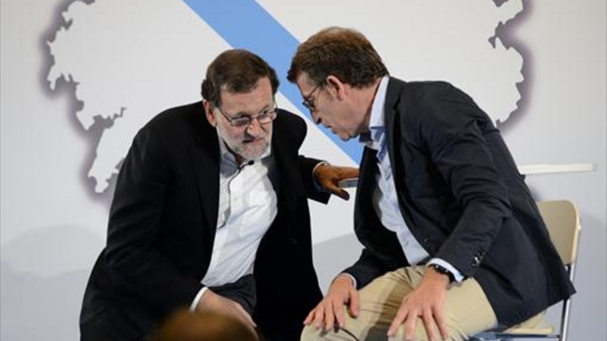 El presidente del Gobierno, Mariano Rajoy, y el de la Xunta, Alberto Núñez Feijóo, en Ourense.