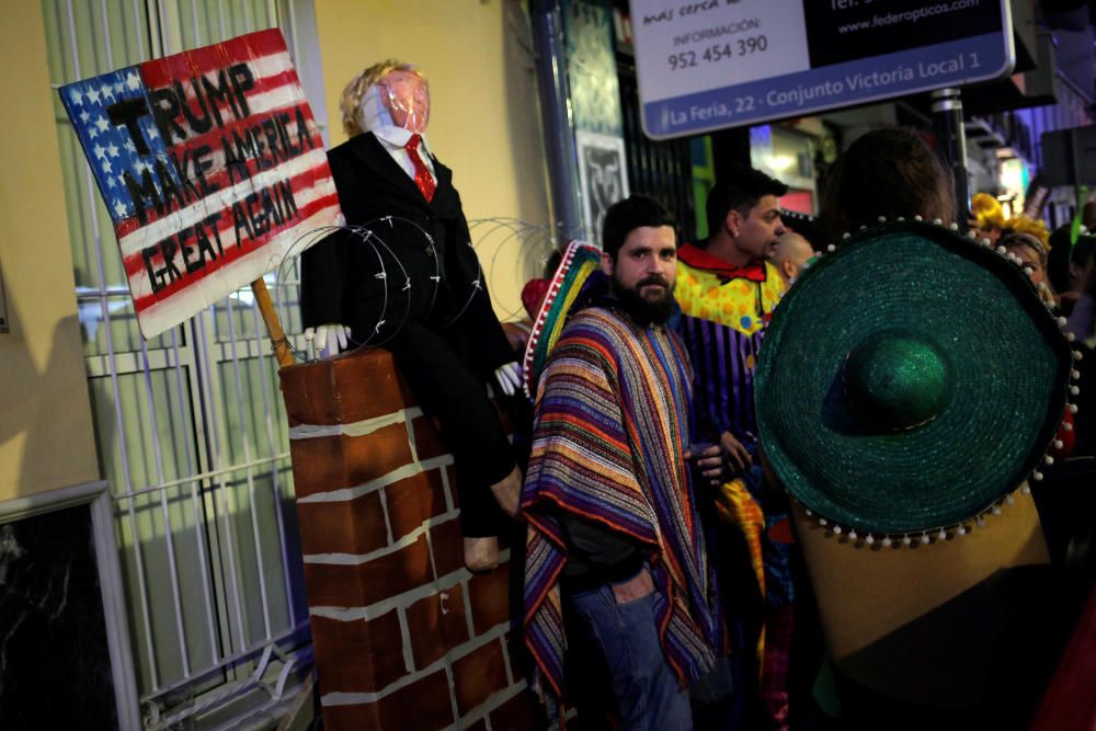 Revellers dressed up as mexicans take part in ...