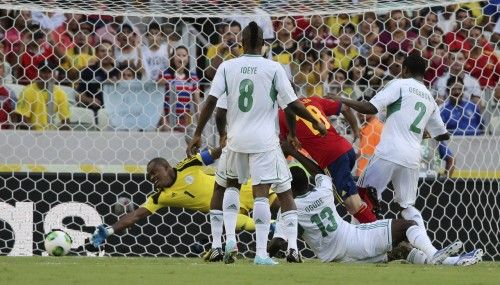 Spain's Alba shoots to score a goal past Nigeria's goalkeeper Enyeama during their Confederations Cup Group B soccer match at the Estadio Castelao in Fortaleza