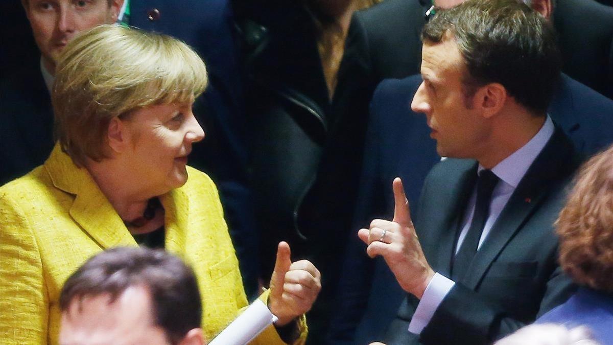 Merkel y Macron, en la cumbre europea de este jueves 14 de diciembre, en Bruselas.