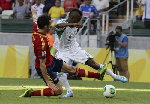 Spain's Arbeloa fights for the ball with Nigeria's Ideye during their Confederations Cup Group B soccer match at the Estadio Castelao in Fortaleza