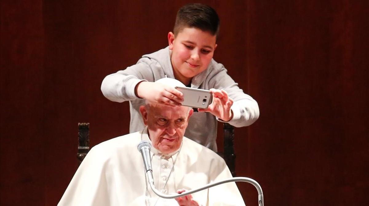 jgblanco37369276 a boy takes selfies with pope francis during a visit at the 170220105104