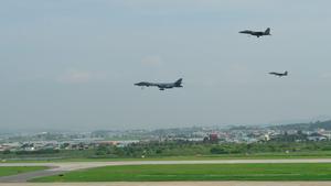 Osan Air Base  Korea  Republic Of   30 07 2017 - A handout photo made available by the US Department of Defense shows two US Air Force B-1B Lancers  in a demonstration of ironclad US commitment to its allies  assigned to the ninth Expeditionary Bomb Squadron  deployed from Dyess Air Force Base  Texas  USA  performing a low pass over Osan Air Base  South Korea  during a 10-hour mission from Andersen Air Force Base  Guam  into Japanese airspace and over the Korean Peninsula  30 July 2017  The B-1s first made contact with Japan Air Self-Defense Force F-2 fighter jets in Japanese airspace  then proceeded over the Korean Peninsula and were joined by South Korean F-15 fighter jets  The mission is a direct response to North Korea s escalatory launch of intercontinental ballistic missiles   Corea del Sur  Japon  Estados Unidos  EFE EPA US AIR FORCE Tech  Sgt  Benjamin Wiseman HANDOUT HANDOUT EDITORIAL USE ONLY NO SALES
