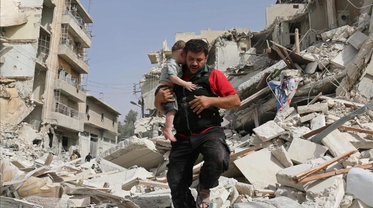 jsauri35623630 a syrian man carries a baby after removing him from the rubb160922142257