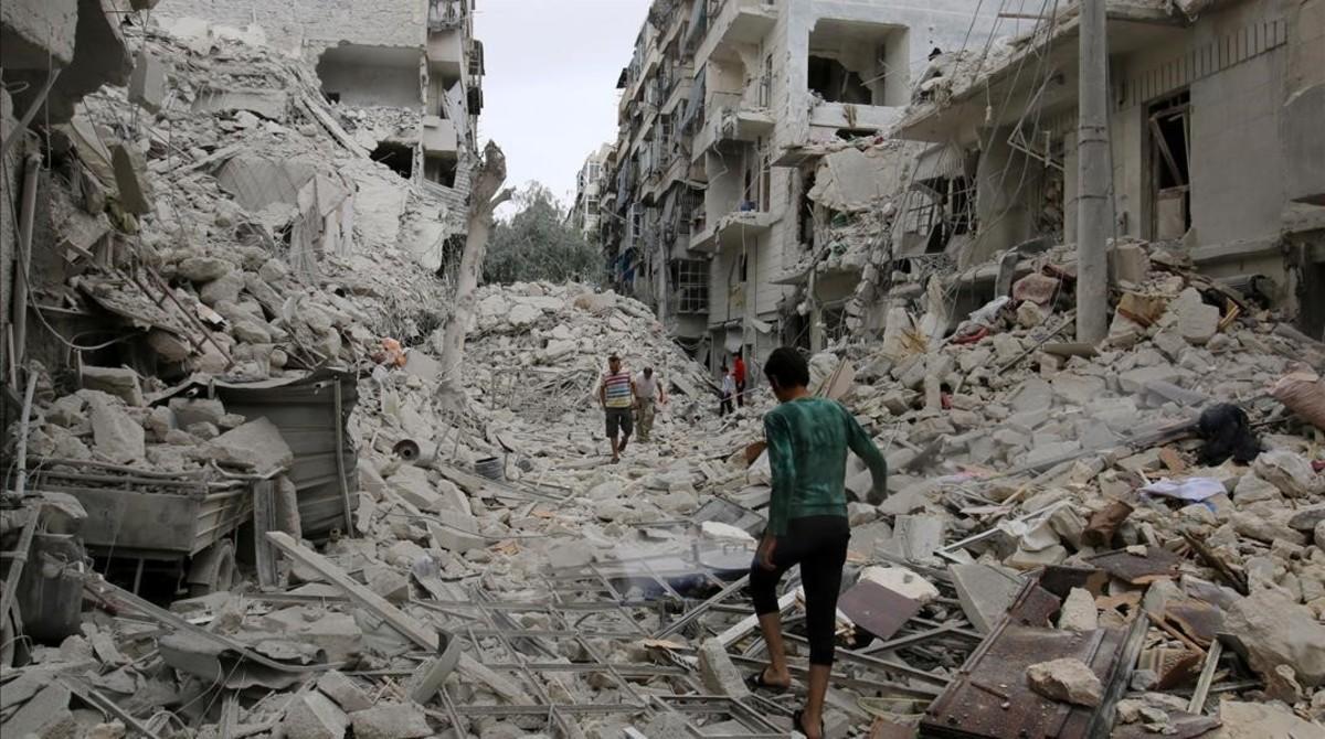 mbenach35647618 people inspect a damaged site after airstrikes on the rebel 160923194242