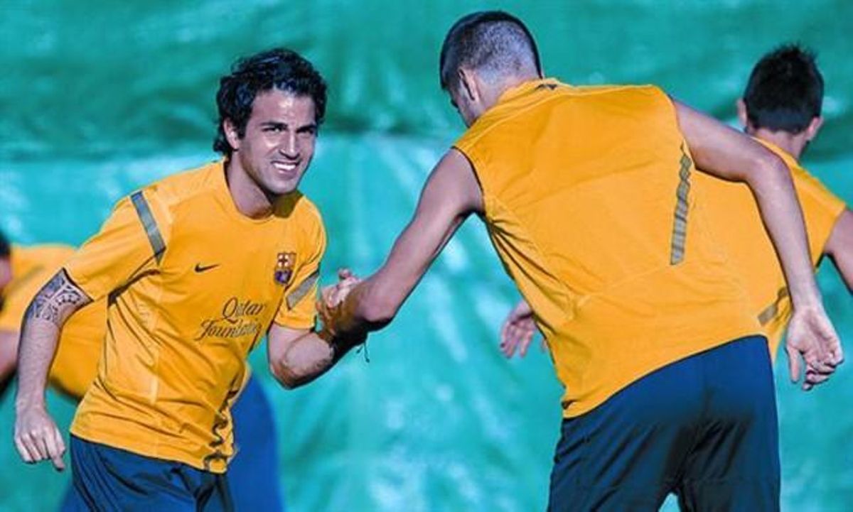 Cesc i Piqué, en l’entrenament d’ahir.