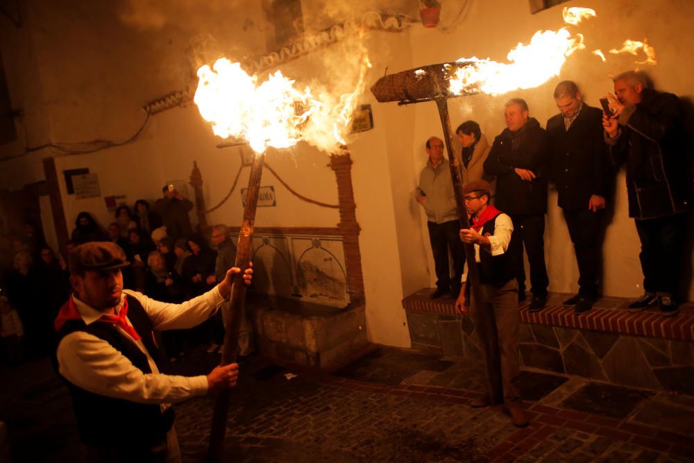 Villagers hold torches during the Divina Pastora ...