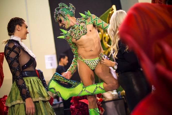 Participant prepares to perform in a drag queen ...