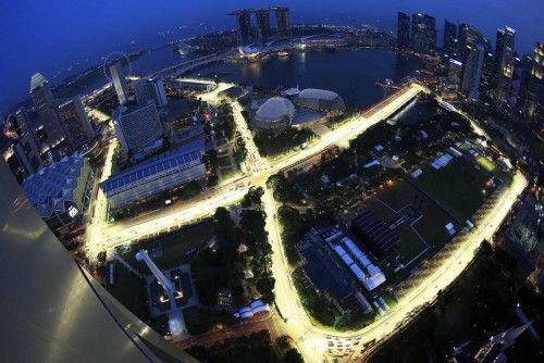 An aerial view at dusk shows the illuminated Marina Bay Street Circuit ahead of the Singapore Formula One Grand Prix