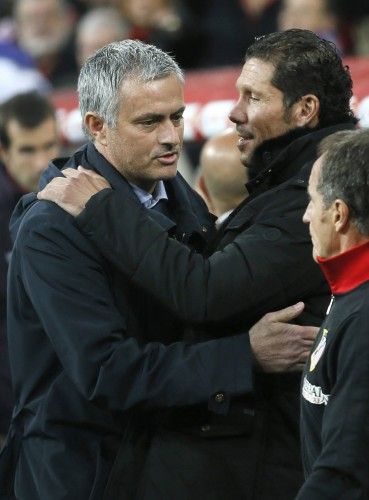 Real Madrid coach Mourinho greets Atletico Madrid's coach Simeone before their Spanish King's Cup soccer match in Madrid