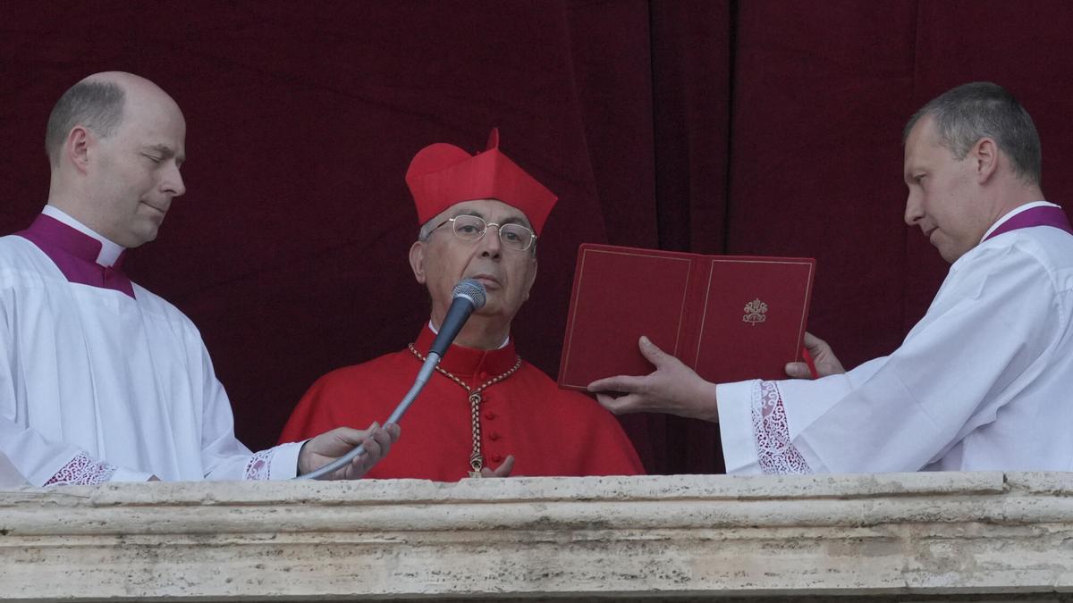 Cardinal Dominique Mamberti announces the election of Cardinal Robert F. Prevost as the 267th pope, choosing the name of Pope Leone XIV, at the Vatican, Thursday, May 8, 2025. (AP Photo/Andrew Medichini)
