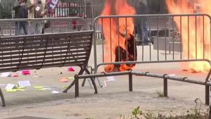 SENSITIVE MATERIAL. THIS IMAGE MAY OFFEND OR DISTURB    A person is covered in flames outside the courthouse where former U.S. President Donald Trumps criminal hush money trial is underway, in New York, U.S., April 19, 2024 in this screen grab taken from a pool video. Reuters TV via REUTERS / SMOUT