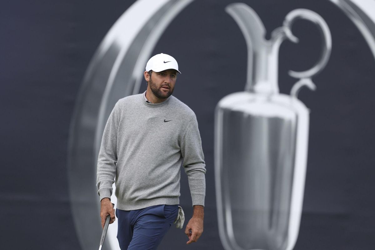 Scottie Scheffler of the United States walks on the 17th green during a practice round for the 2025 British Open golf championship at the Royal Portrush Golf Club, Northern Ireland, Monday, July 14, 2025. (AP Photo/Peter Morrison)