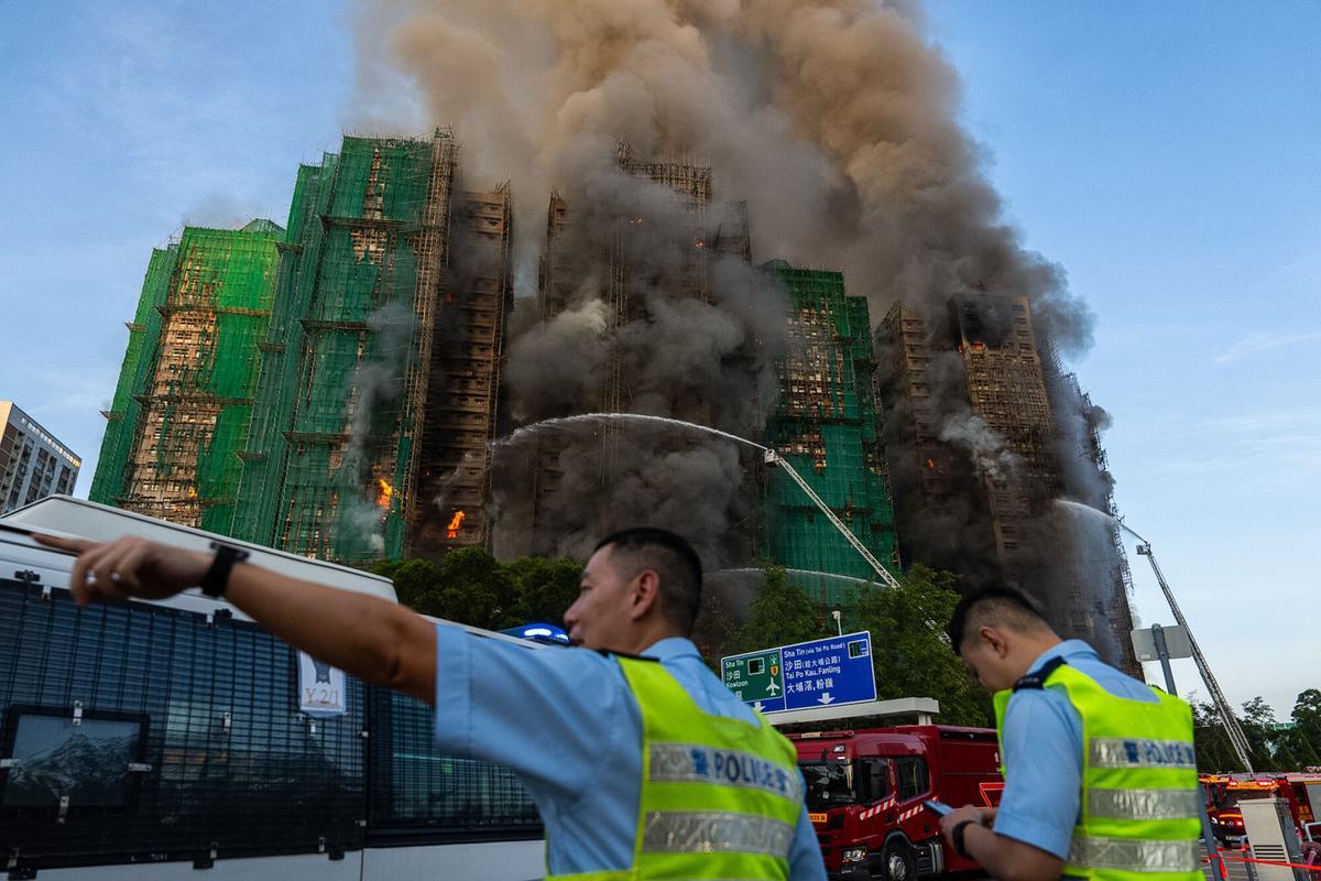 First responders work the scene of a fire at Wang Fuk Court, a residential estate in the Tai Po district of Hong Kongs New Territories on Wednesday, Nov. 26 2025. (AP Photo/Chan Long Hei)