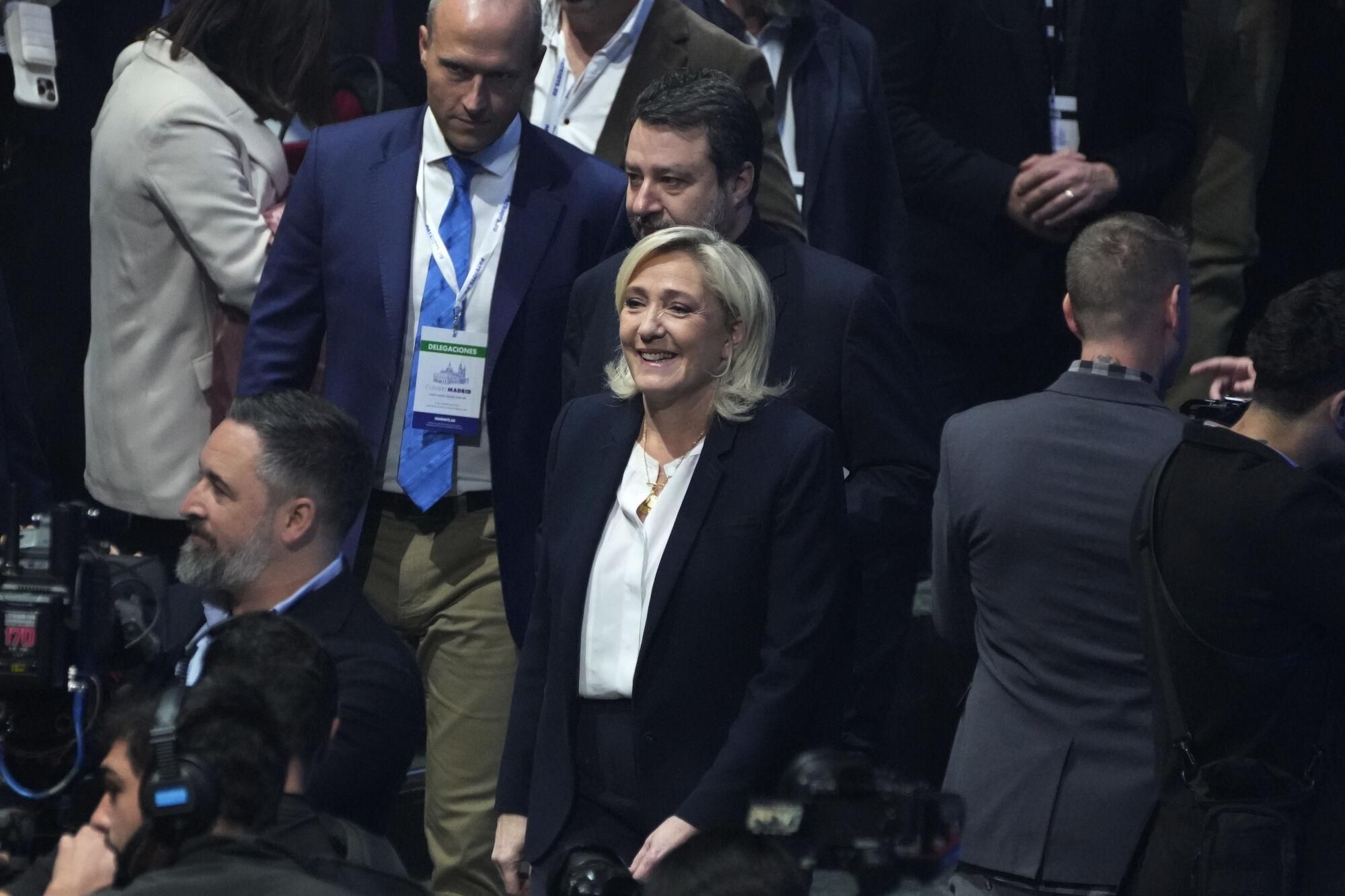 French far-right leader Marine Le Pen, centre, arrives with far-right VOX party leader Santiago Abascal, left and Italy's vice Premier Matteo Salvini, centre top at the Patriots for Europe summit in Madrid, Spain, Saturday, Feb. 8, 2025. AP Photo/Paul White)