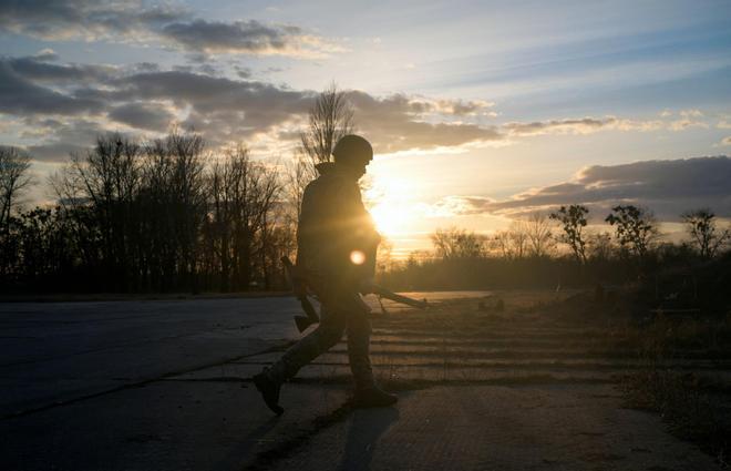 A Ukrainian serviceman takes position at the military airbase Vasylkiv in the Kyiv region