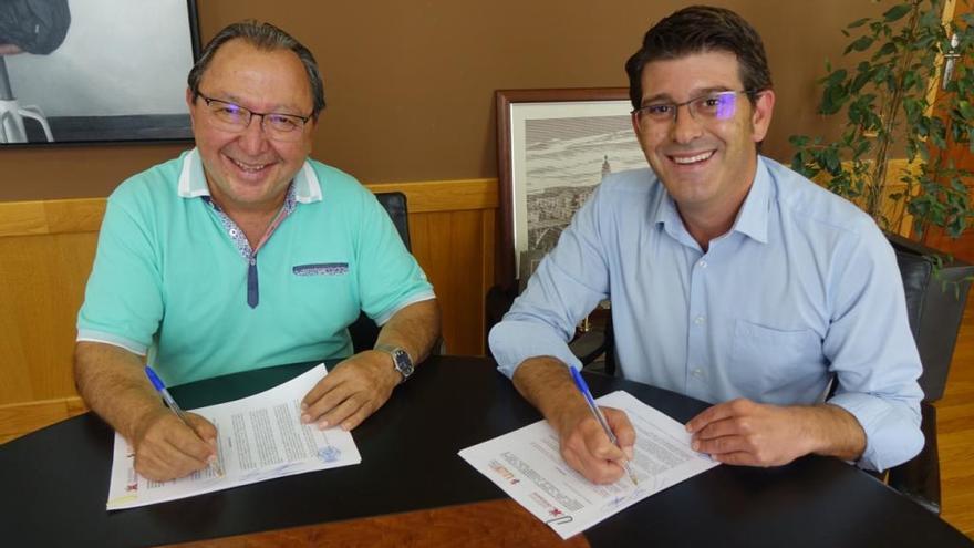 Vicent Sanchis y Jorge Rodríguez en la firma del convenio