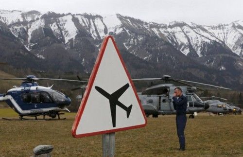 Rescue helicopters from the French Securite Civile and the Air Force are seen in front of the French Alps during a rescue operation next to the crash site of an Airbus A320