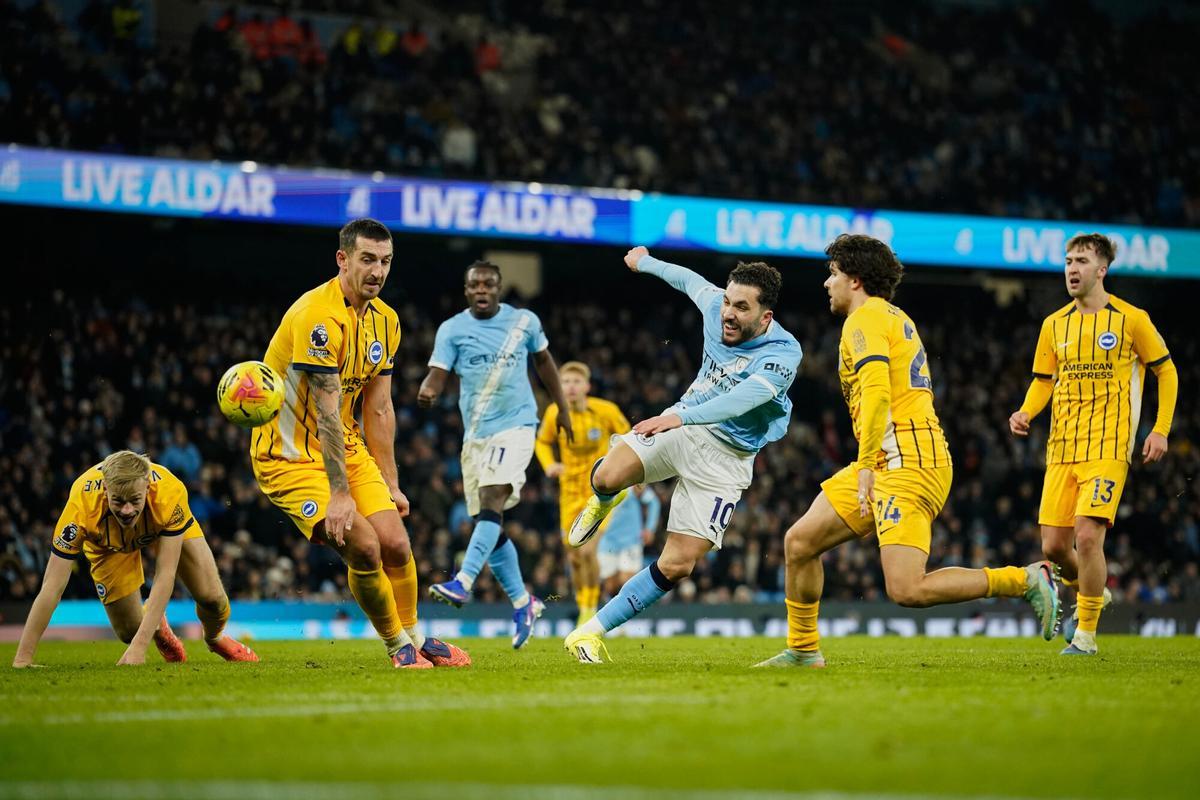 Manchester City's Rayan Cherki, third right, attempts a shot at goal in front of Brighton's Lewis Dunk during the English Premier League soccer match between Manchester City and Brighton and Hove Albion in Manchester, England, Wednesday, Jan. 7, 2026. (AP Photo/Dave Thompson)