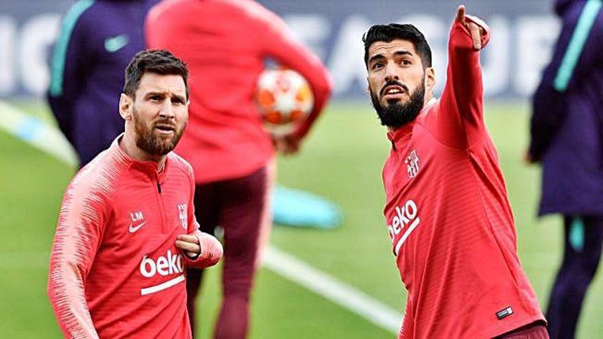 Leo Messi i Luis Suárez, ahir a l&#039;estadi d&#039;Anfield.