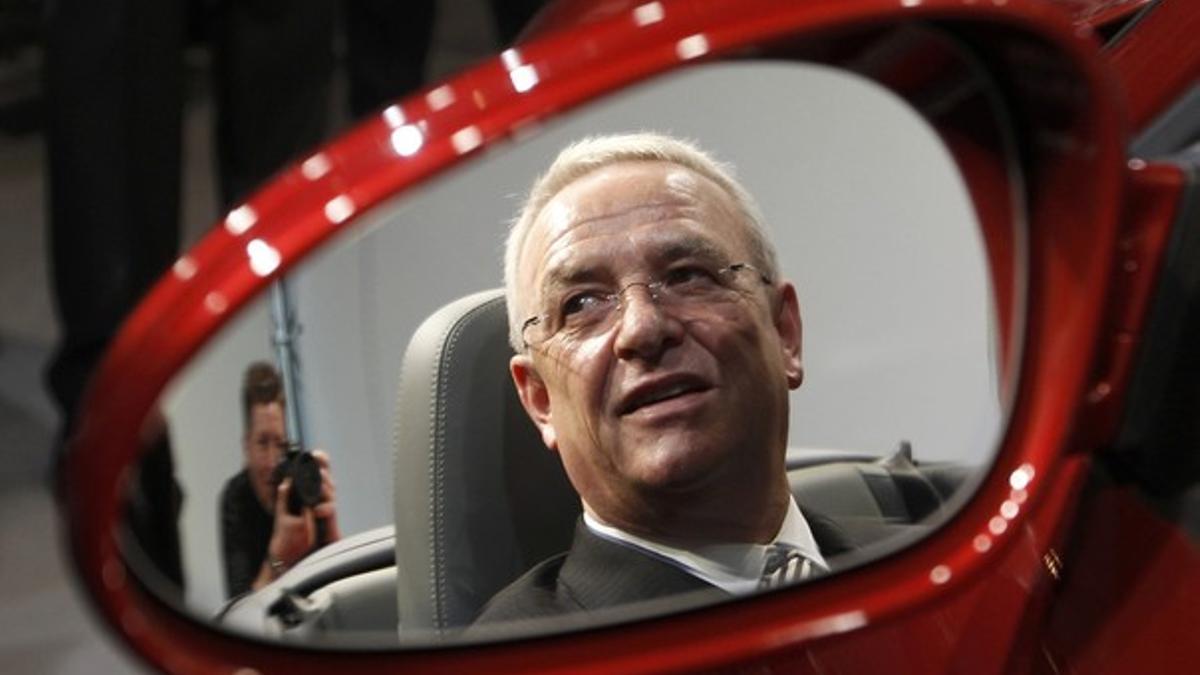 File photo of Volkswagen AG's CEO Winterkorn reflected in a mirror as he sits in a Porsche 911 Carrera Sports Car after the company's annual news conference in Stuttgart