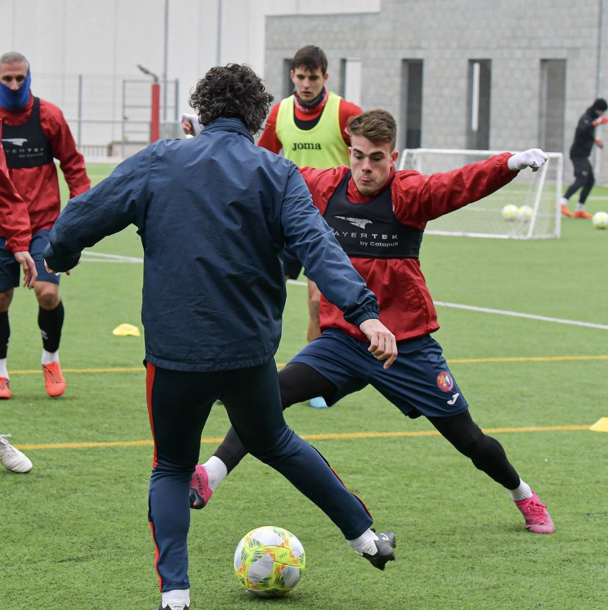 Raúl Garrido y Pep Chavarría durante un entrenamiento
