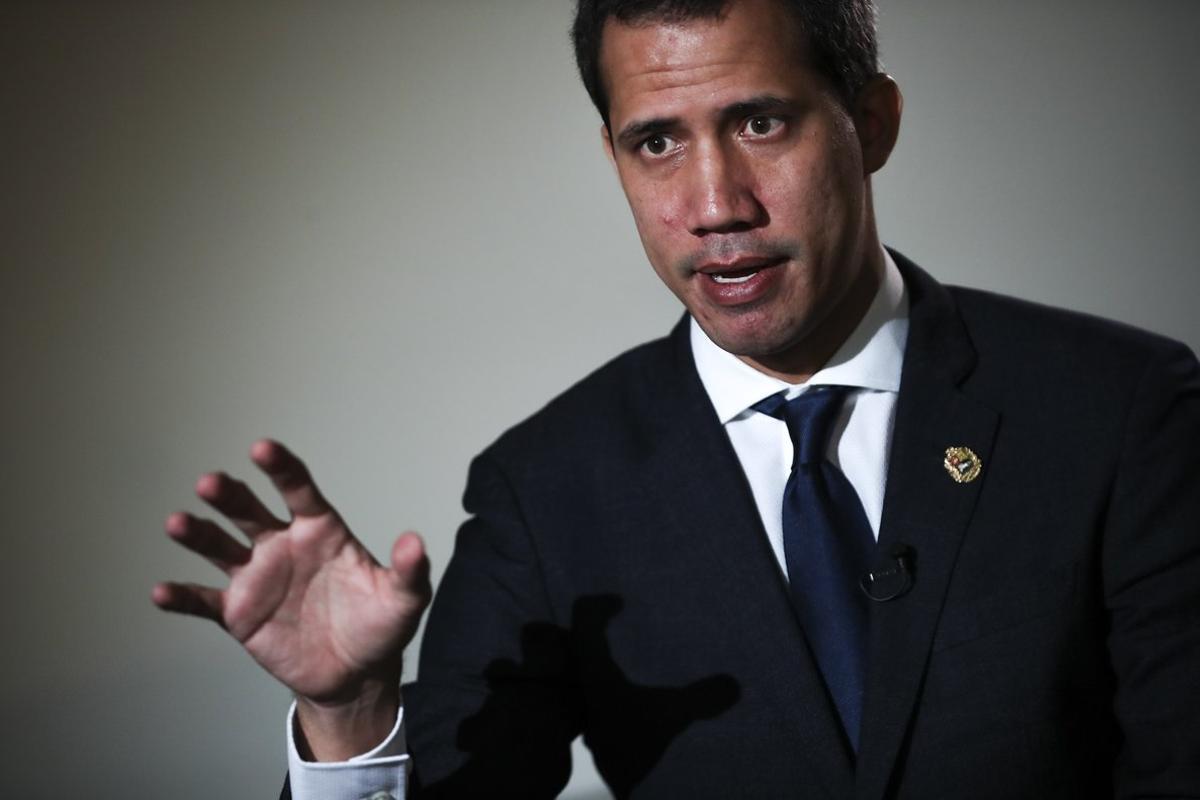 Leader of Venezuela’s political opposition Juan Guaido talks to a journalist during an interview with Associated Press in Brussels, Wednesday, Jan. 22, 2020. Intelligence police raided the office of Juan GuaidÃ³ on Tuesday, while the U.S.-backed opposition leader was travelling in Europe seeking to bolster support for his campaign to oust Venezuelan President NicolÃ¡s Maduro. (AP Photo/Francisco Seco)