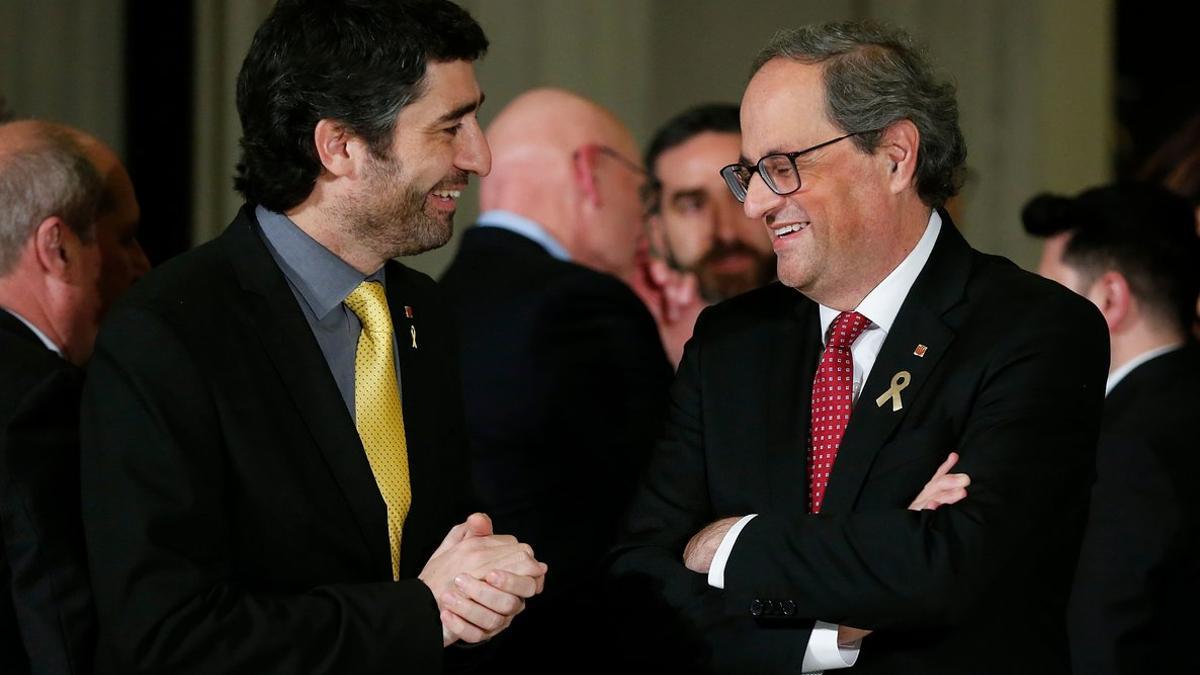 El 'conseller' de Polítiques Digitals, Jordi Puigneró, y el 'president', Quim Torra, durante el Mobile World Congress, el pasado febrero.