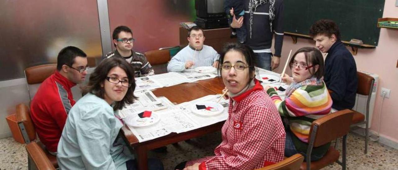 Grupo de personas con discapacidad, algunos de ellos con síndrome de Down. // Iñaki Osorio