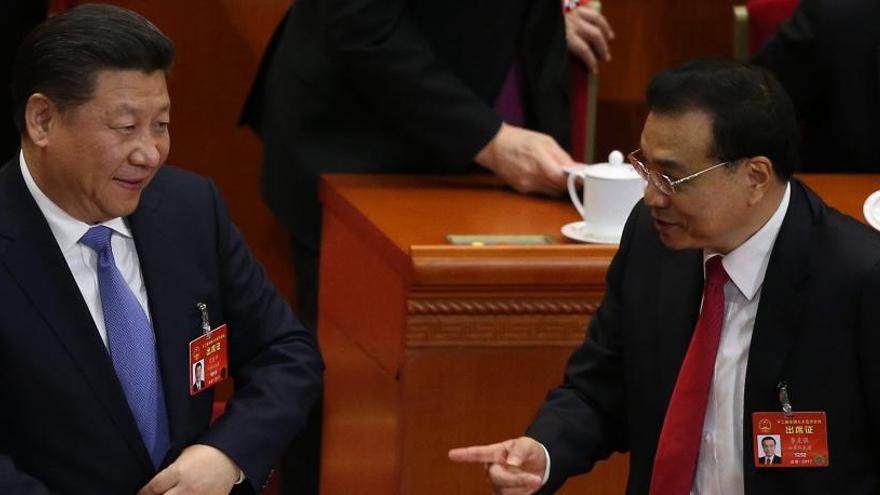 Keqiang (dcha.), con el presidente Xi Jinping.