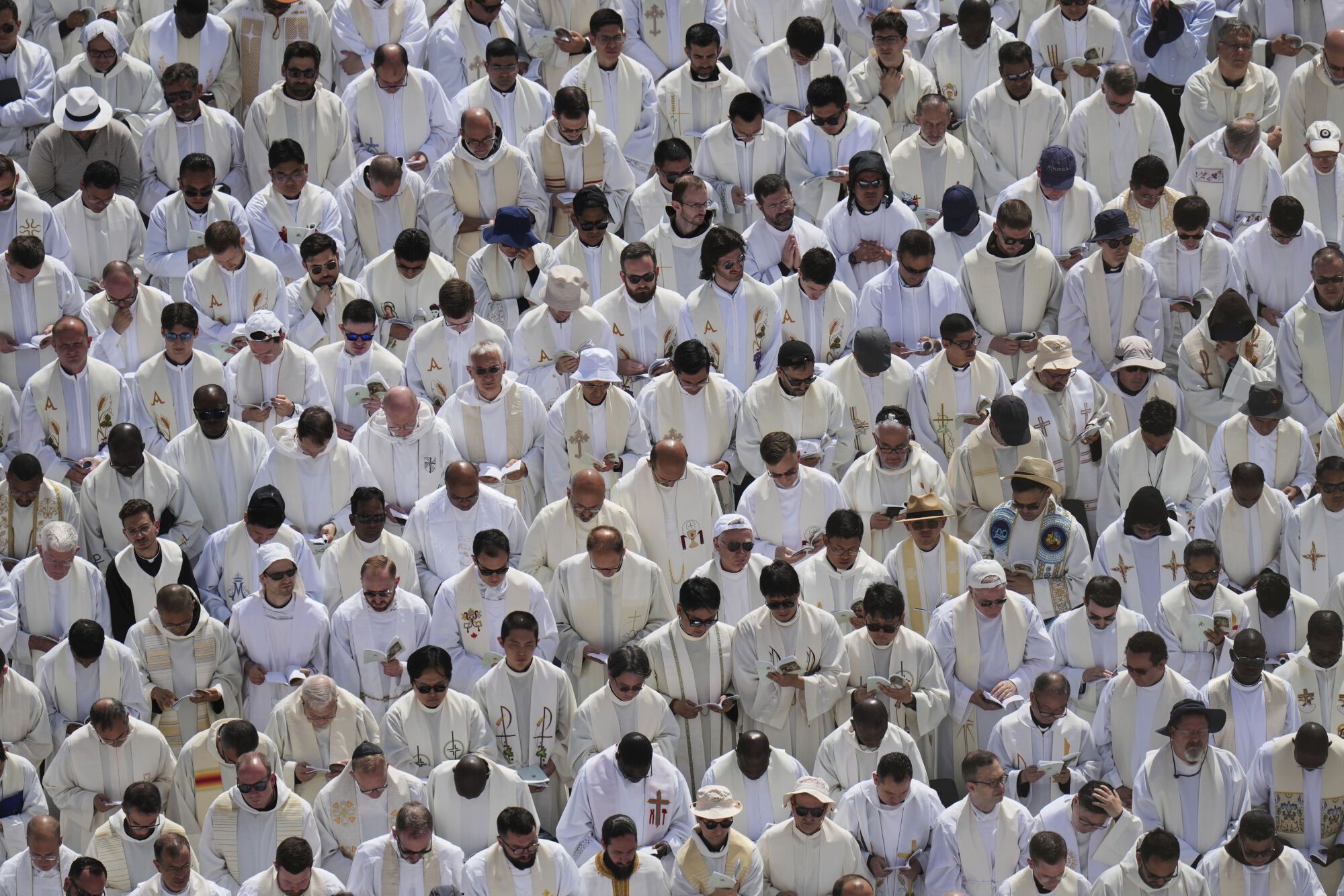 Catholic priests gather as Pope Leo XIV celebrates a Mass for the formal inauguration of his pontificate, in St. Peter's Square, at the Vatican, Sunday, May 18, 2025. (AP Photo/Alessandra Tarantino)